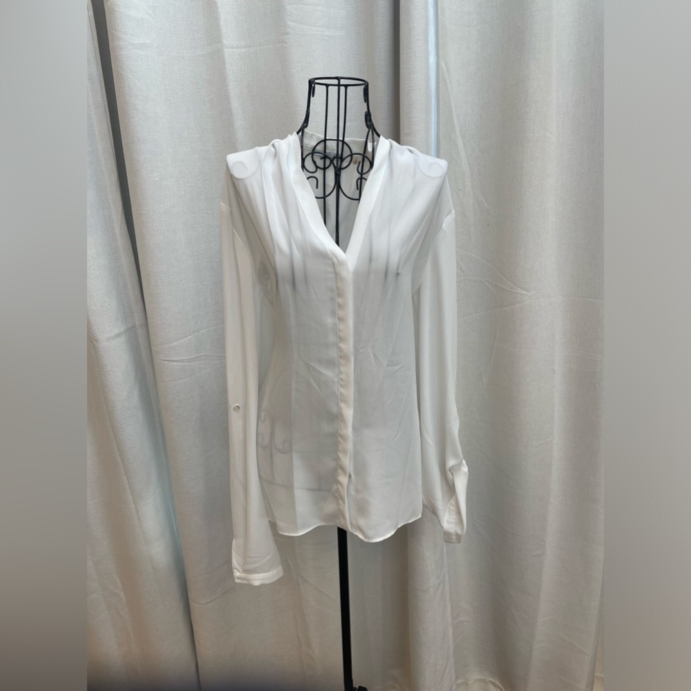 Tahari long sleeve silky shirt with buttons and adjustable sleeves.